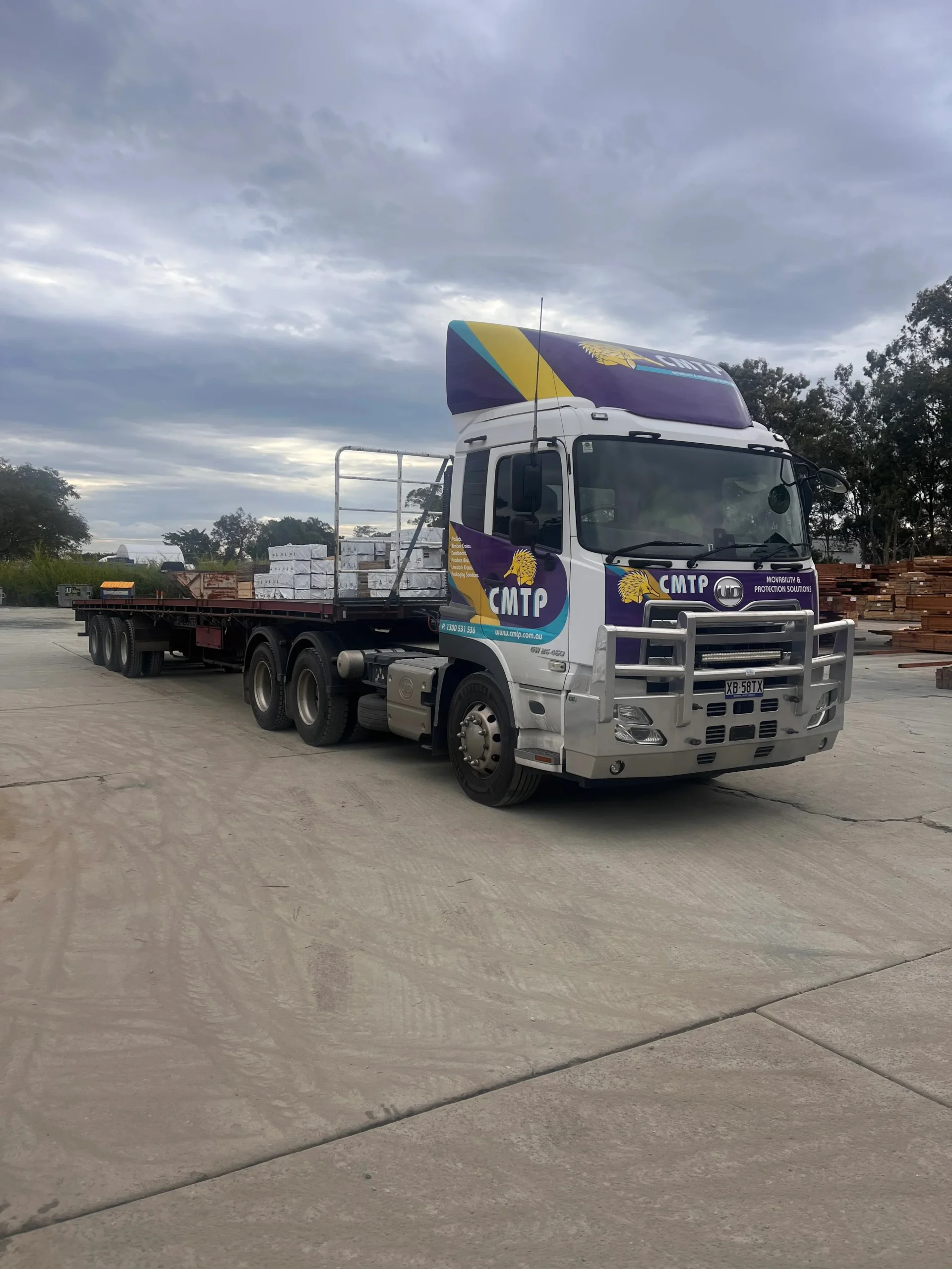 A CMTP truck parked in the yard at a CMTP manufacturing site, ready to be loaded for delivery