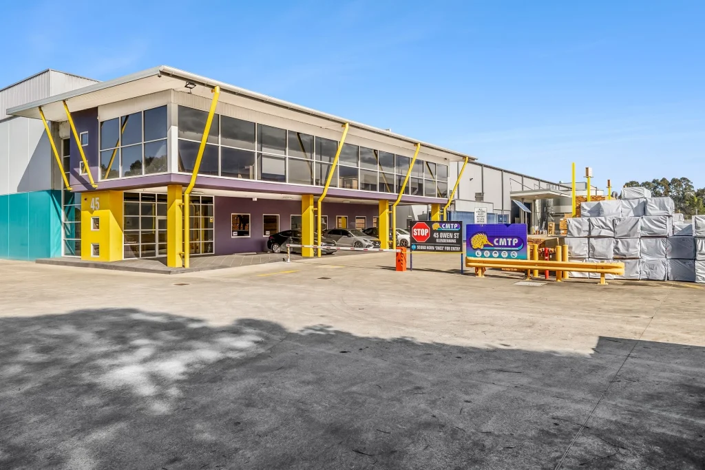 Custom wooden produce bins and timber storage crates lined up on the driveway at CMTP Glendenning, Sydney