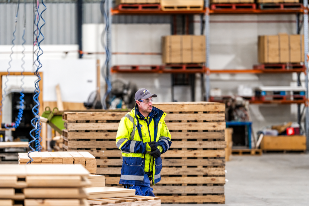 CMTP team member walking through the pallet manufacturing site in Albury
