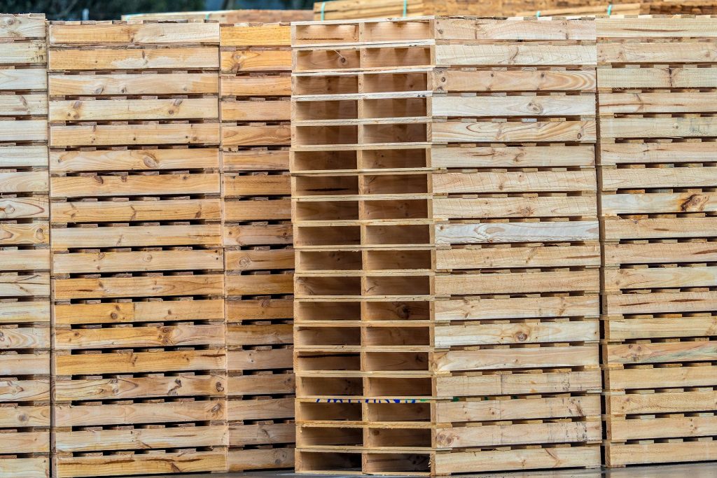 The CMTP pallet manufacturing facility in Derrimut, with the factory and stacked pallets in the yard