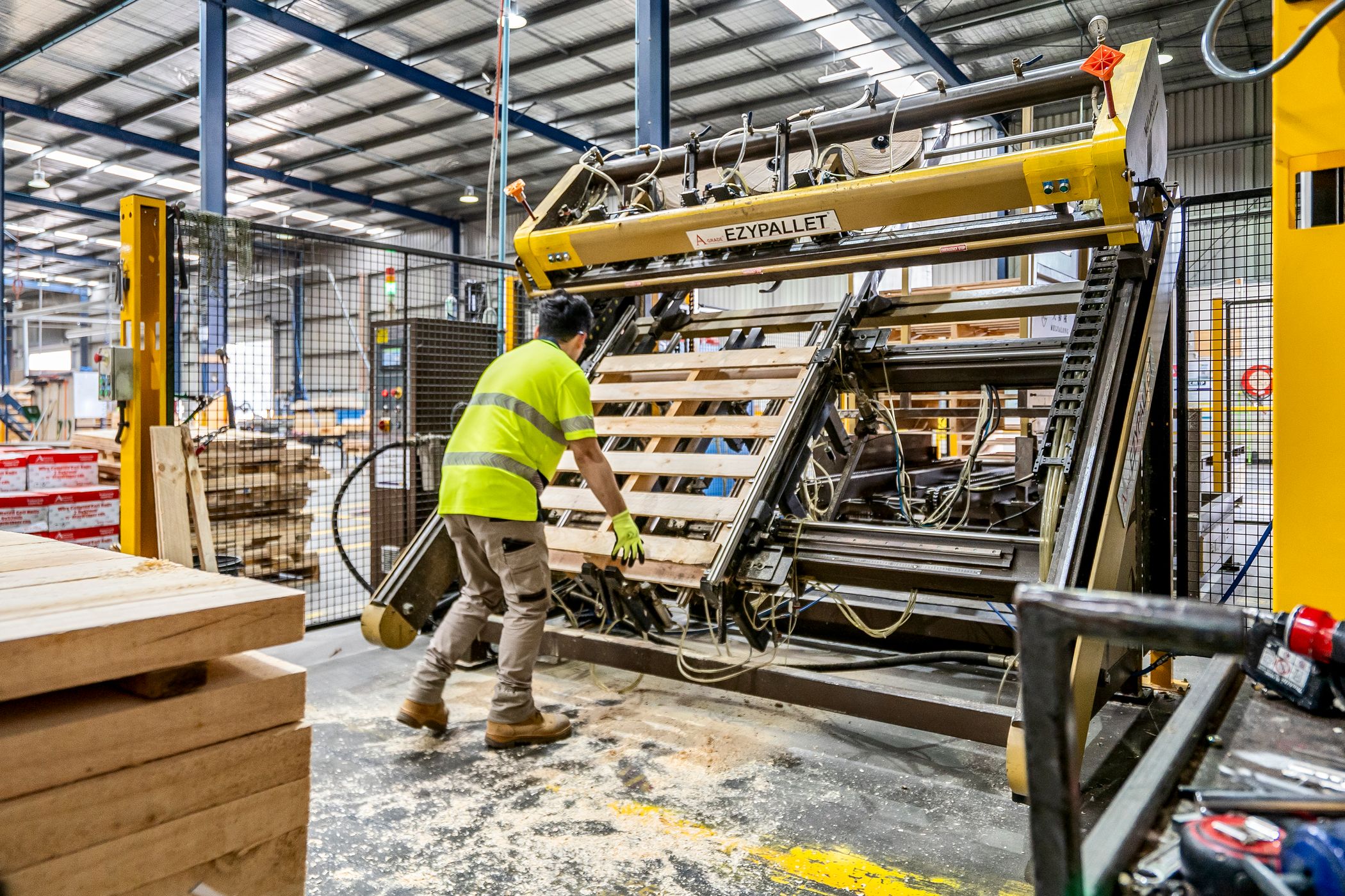 Medium-duty wooden retail pallet being assembled on the production floor at CMTP