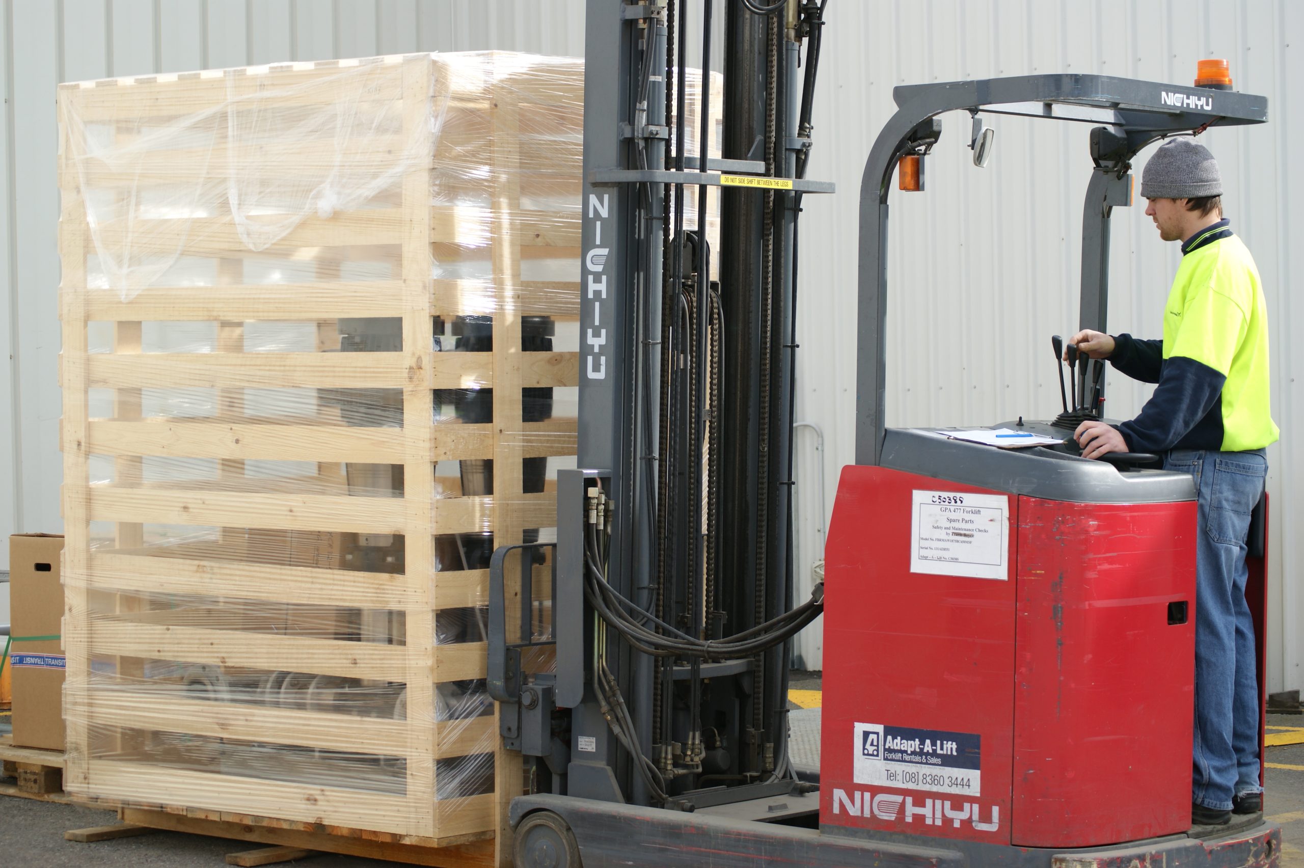 Mining equipment being moved by forklift through a CMTP factory, packed and ready for delivery