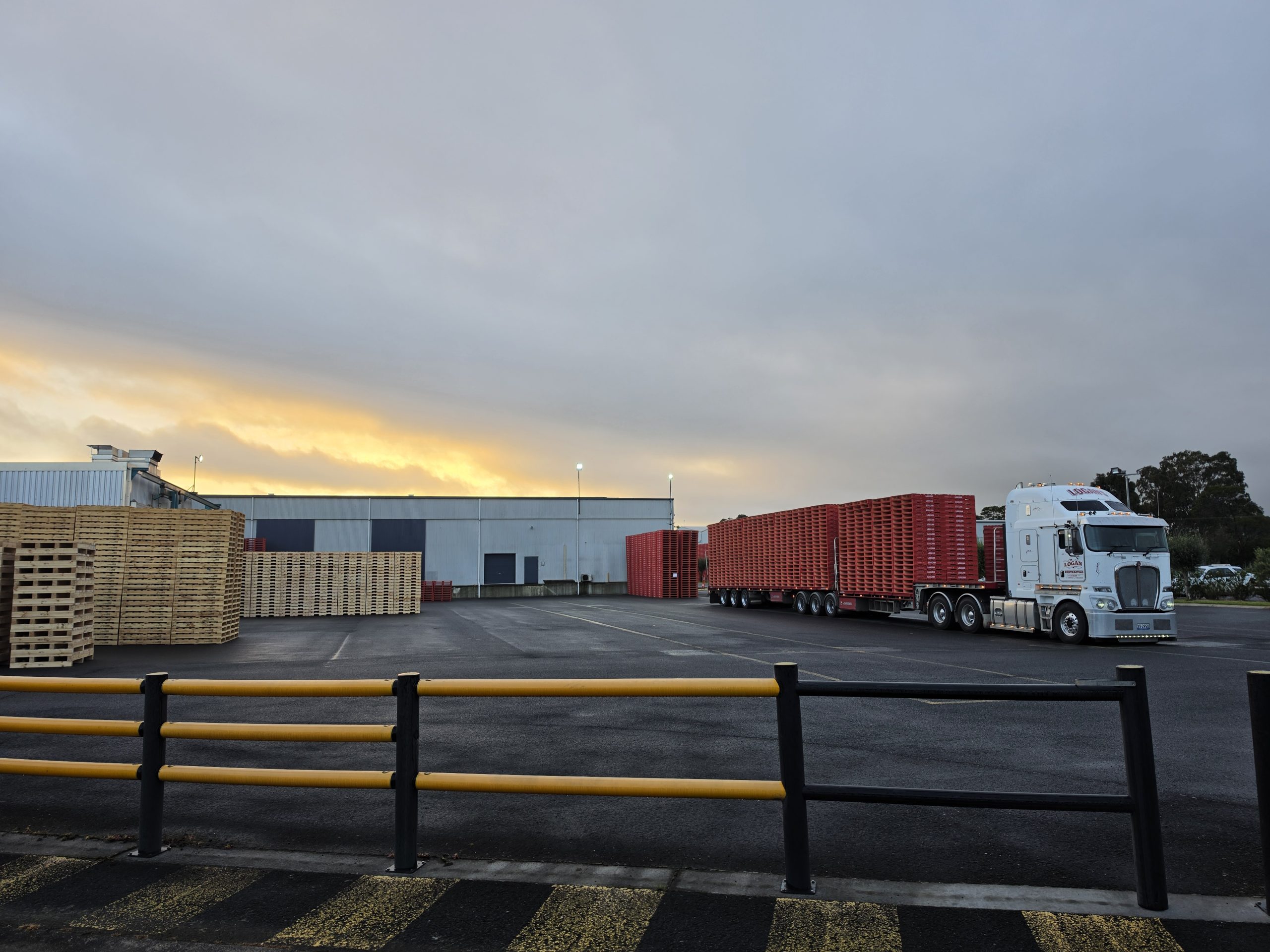 Stacks of timber pallets built by CMTP for third-party logistics and warehousing operators