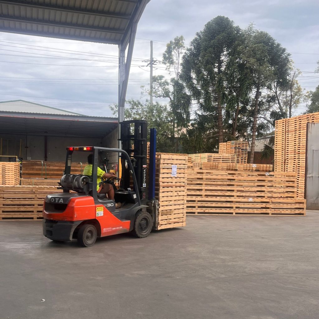 Rows of stacked timber pallets ready for dispatch at the CMTP Clontarf site in Moreton Bay